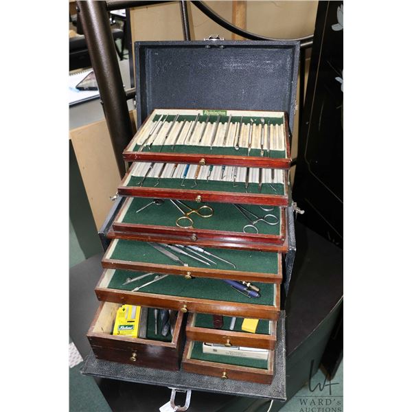 Remington leather wrapped 8 drawer tool box with assorted hand tools including picks, sculpting tool