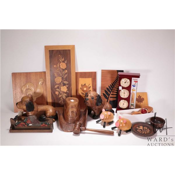 Selection of treenware including carved dogs, cowboy hat, gavel, wind chime etc. and a temperature b