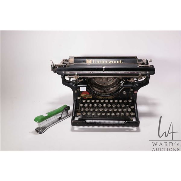 Antique Underwood typewriter with original lithgraphs and a vintage Ace Liner model 502 stapler