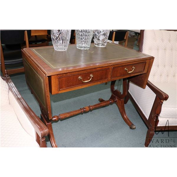 Modern antique style two drawer drop leaf server with leather top, lyre supports and brass capped cl
