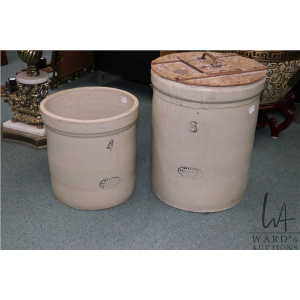 Two Medalta crocks including a four gallon and an eight gallon and one homemade wooden lid