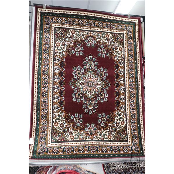 Modern polyester area carpet with deep cranberry background and highlights of black, green, cream et