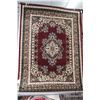 Image 1 : Modern polyester area carpet with deep cranberry background and highlights of black, green, cream et