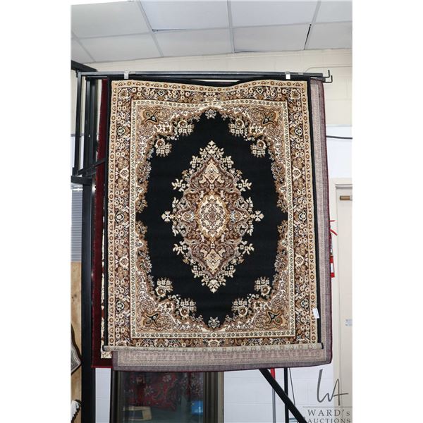Modern polyester areas carpet, with center medallion, black background and highlights of black and c