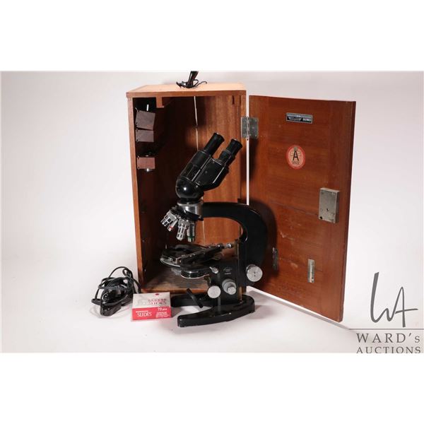 Vintage Tiyoda microscope with four position turret, double eye piece, box and accessories