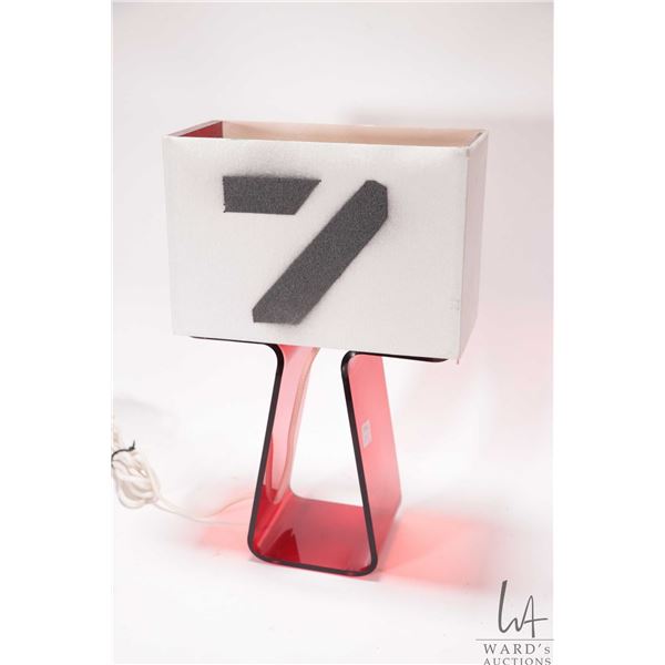 Pablo Designs Tube top table lamp by designer Peter Stathis