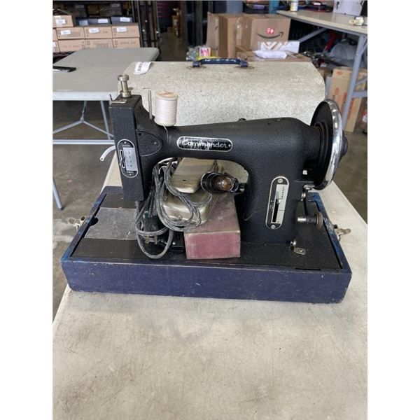 CASED SEWING MACHINE