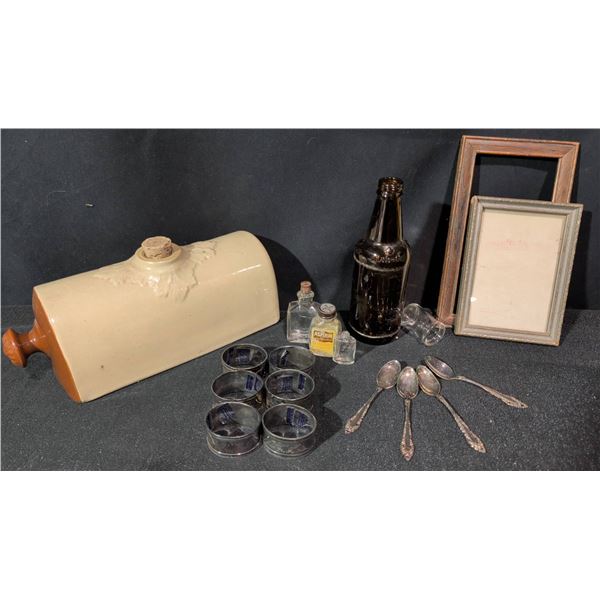 Diverse Vintage Items Including Stoneware Jug, Silver-Plated Napkin Rings, and Decorative Frames
