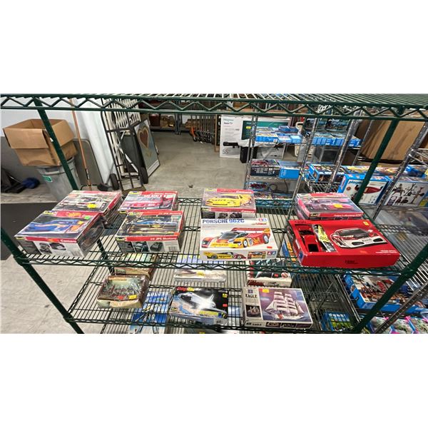 SHELF OF ASSORTED MODEL CAR KITS