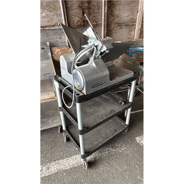 HOBART COMMERCIAL MEAT SLICER ON 3-TIER PLASTIC MOBILE CART