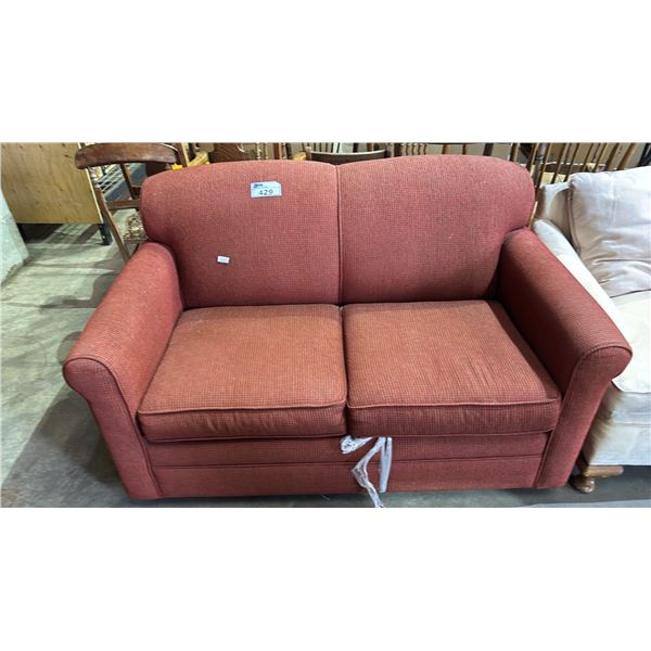 RED FABRIC UPHOLSTERED LOVESEAT WITH PULL-OUT SOFA BED