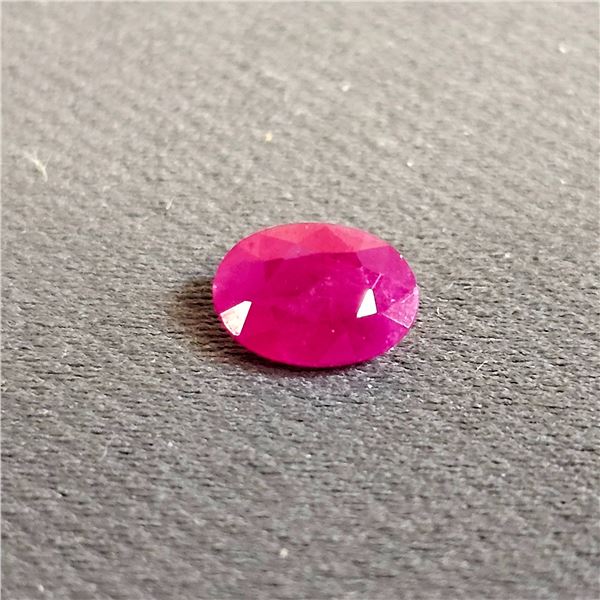 RED OVAL CUT RUBY: APPROX. 1.25 CT