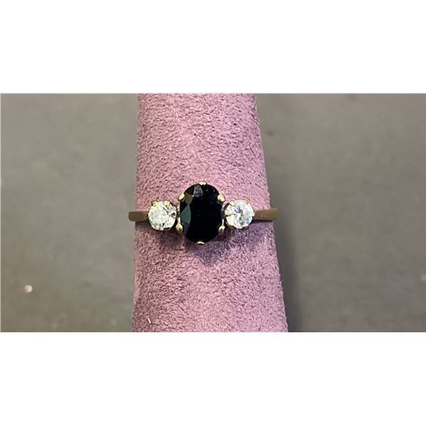 9KT YELLOW & WHITE GOLD RING SET WITH OVAL BLUE SAPPHIRE & 2 CUBIC ZIRCONIA: SIZE 7