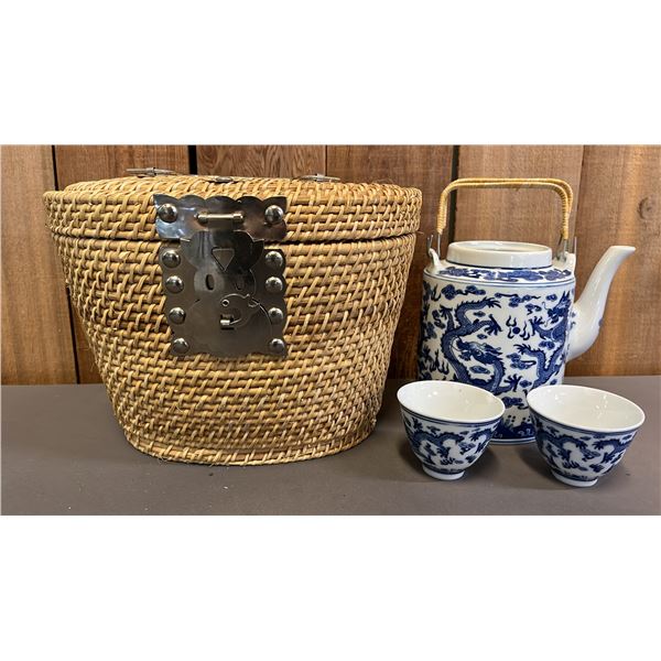 ASIAN PORCELAIN TEAPOT WITH 2 CUPS IN WICKER BASKET *TEAPOT IS MISSING LID*