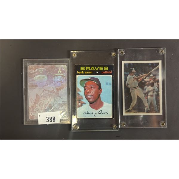 (3) ASSORTED BASEBALL CARDS INCLUDING; HANK AARON, CAL RIPKEN, JR., NOLAN RYAN & REGGIE JACKSON