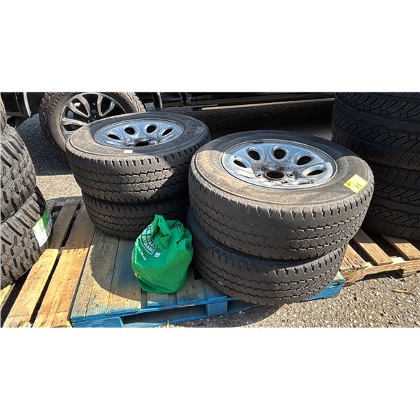 SET OF 4 FIRESTONE TRANSFORCE AT LT245/70R17 TIRES MOUNTED ON 6 BOLT METAL RIMS WITH CHEVY HUBCAPS