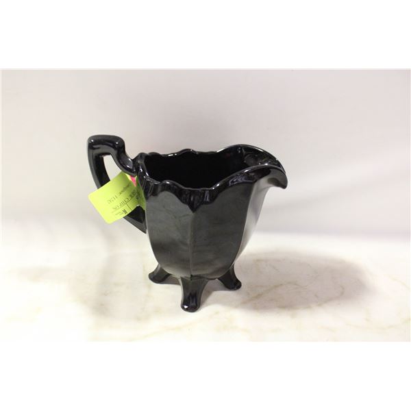 BLACK GLASS CREAMER. CHIP ON THE FOOT