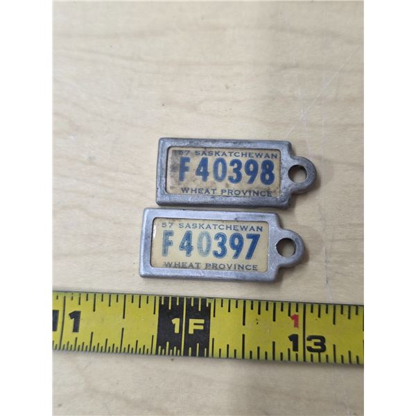 2 1957 sask war amp key tags- consecutive numbers