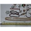 Image 2 : Large collection of assorted vintage costume jewelry, including brooches, necklaces, and bracelets.