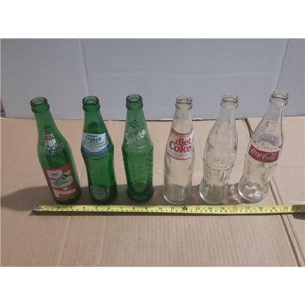 (6) Vintage Pop Bottles.