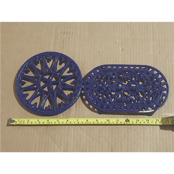 Vintage-style trivets feature a blue enamel finish over cast iron construction.