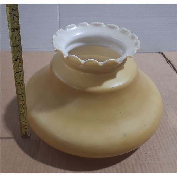 Vintage yellow milk glass lamp shade features a distinctive ruffled edge.