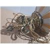Image 3 : Vintage Hollywood Regency swag lamp features a milk glass globe adorned with gold embossed designs a