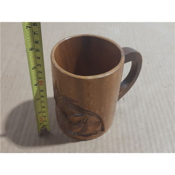 Vintage monkey pod wood mug featuring hand-carved Hawaiian pineapple and palm tree designs.