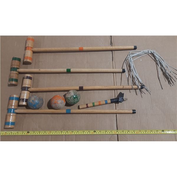 Vintage wooden croquet set, likely from the mid-20th century, containing mallets, balls, etc.