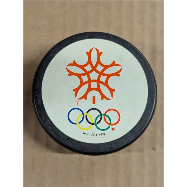 Vintage COA Olympics General Tire Slug Official Game Puck 1979
