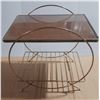 Image 1 : Vintage Mid-Century Modern table features a gold-toned brass tubular design with a smoked glass top 