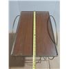 Image 4 : Vintage Mid-Century Modern table features a gold-toned brass tubular design with a smoked glass top 