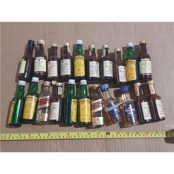 Collection features various miniature alcohol bottles, including brands like Cutty Sark, Seagram's V
