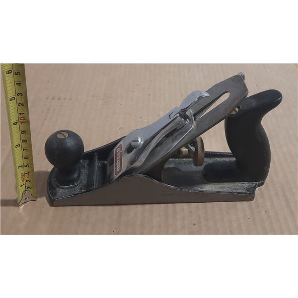 Vintage hand plane, commonly used for smoothing wood surfaces.
