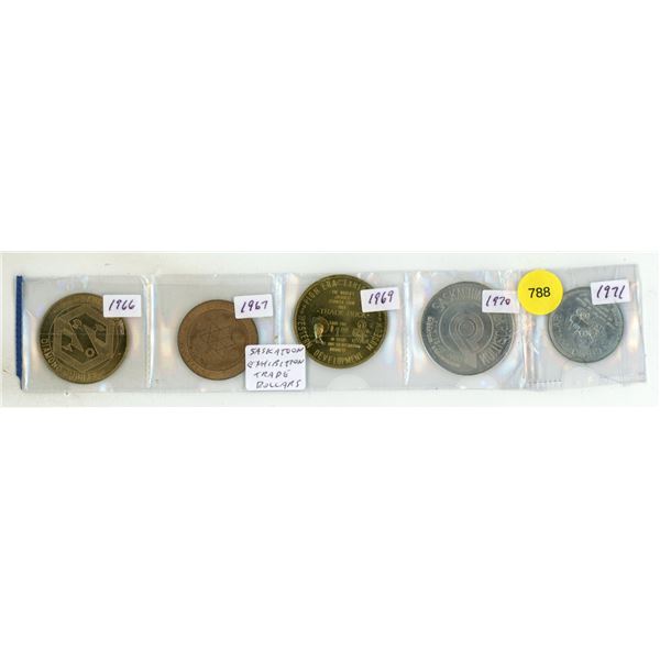 Set of vintage Saskatoon Exhibition trade dollars and souvenir coins ranging from 1966 to 1971.