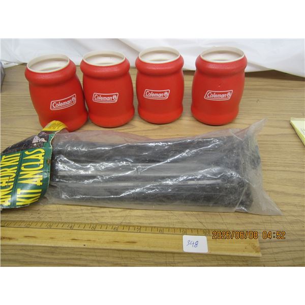 4 Coleman Drink Coolers and a Package of Tent Pegs