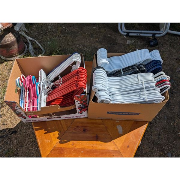 2 boxes plastic clothes hangers