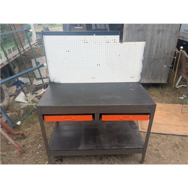 Large workbench with pegboard backing panel