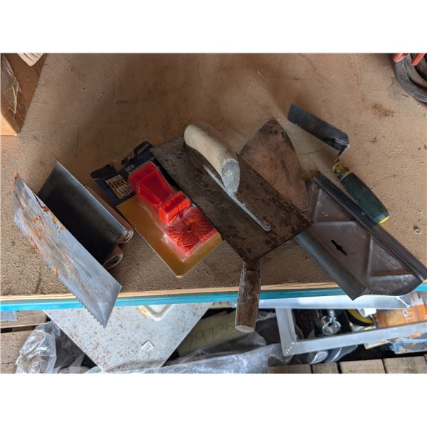 assorted concrete trowels