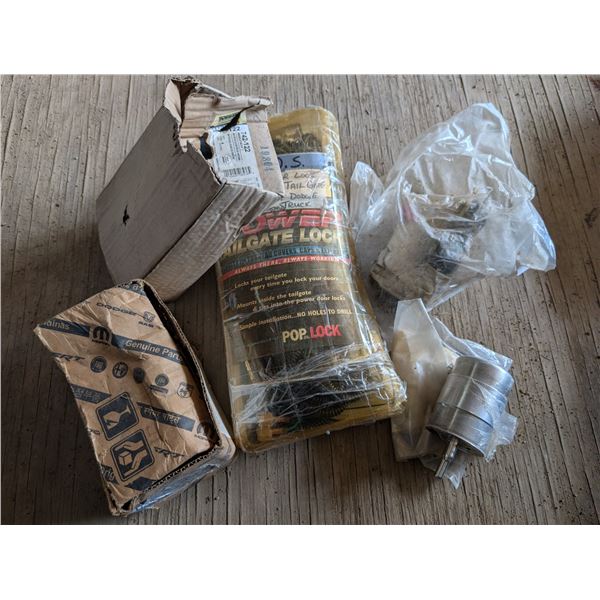 Box of Dodge Ram Parts (Power Lock, Door Latch, and etc.)