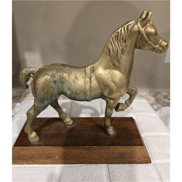 49 - Vintage solid brass horse statue on wood base. 6 1/2" tall includes base.
