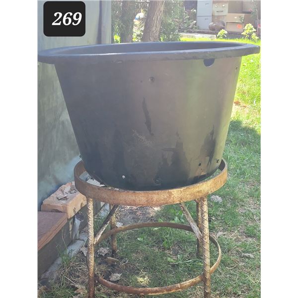 Rebar stand with large pot.