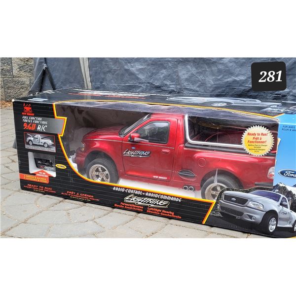 New in box. Radio controlled  Ford Lightning truck. 27” long, opening parts, speeds & sound