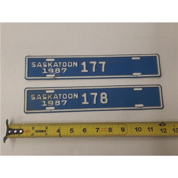 Vintage 1987 Saskatoon, Saskatchewan contractor license plates numbered 177 and 178.