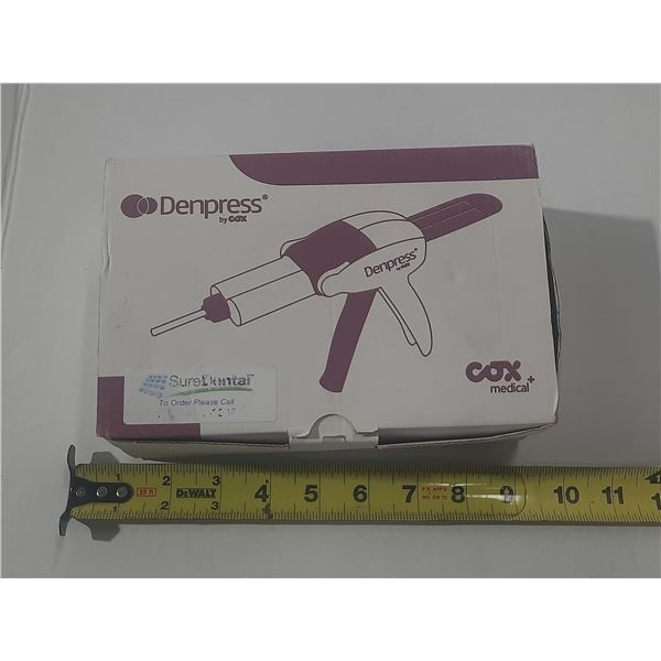 COX Medical Denpress dispensing gun, a dental tool designed to extrude impression materials from car