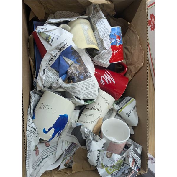 large box of mugs with some plates and other dishes