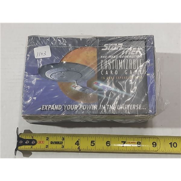 This is a factory-sealed display box for the Star Trek: The Next Generation Customizable Card Game.