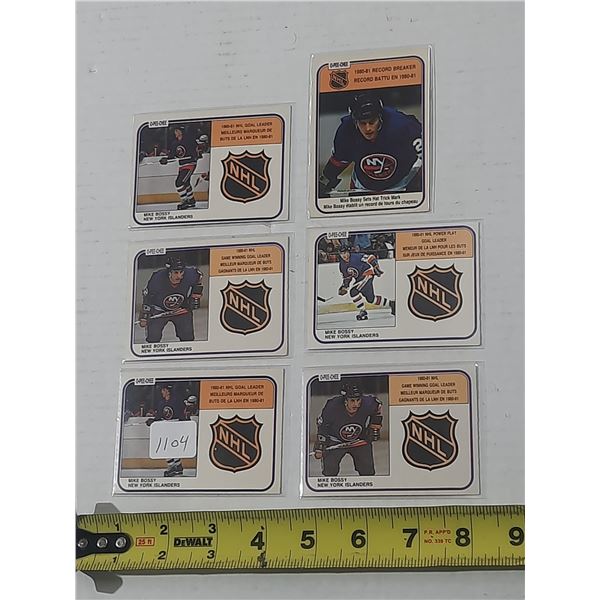 This collection features several 1981-82 O-Pee-Chee Mike Bossy hockey cards, including leader and re