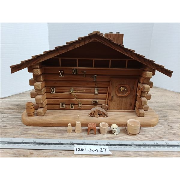 Handmade wooden cabin clock with figures