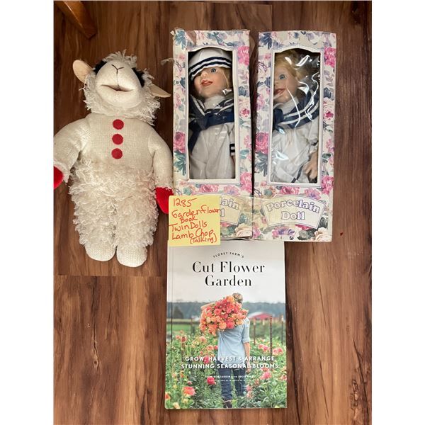 Twin porcelain dolls, lamp chop and flower garden book